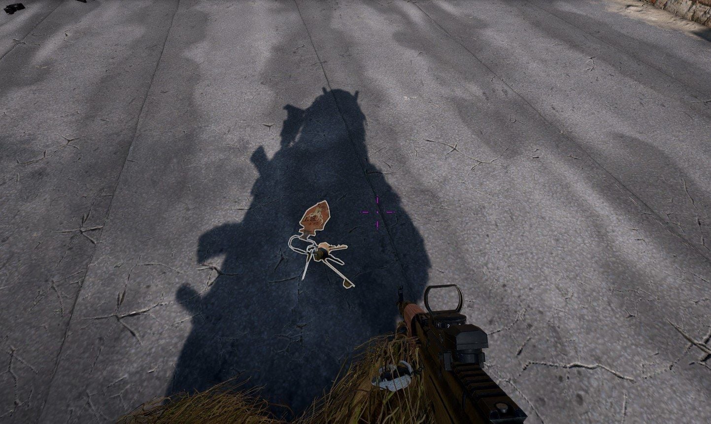 Secret Basement Key as floor loot on cracked concrete in PUBG Mobile