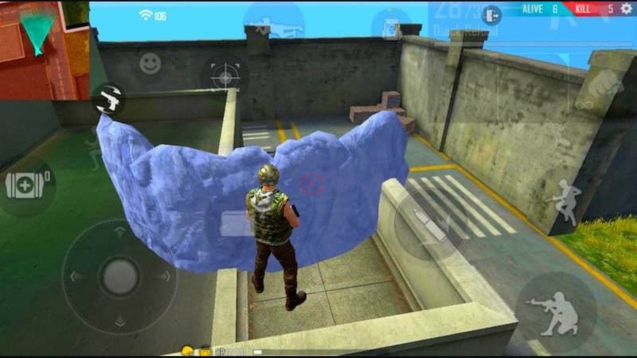 Free Fire HUD in a live fight with Gloo Wall, joystick, and fire cluster visible