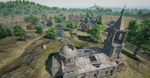 PUBG Mobile screenshot of Pochinki church compound showing strategic positioning